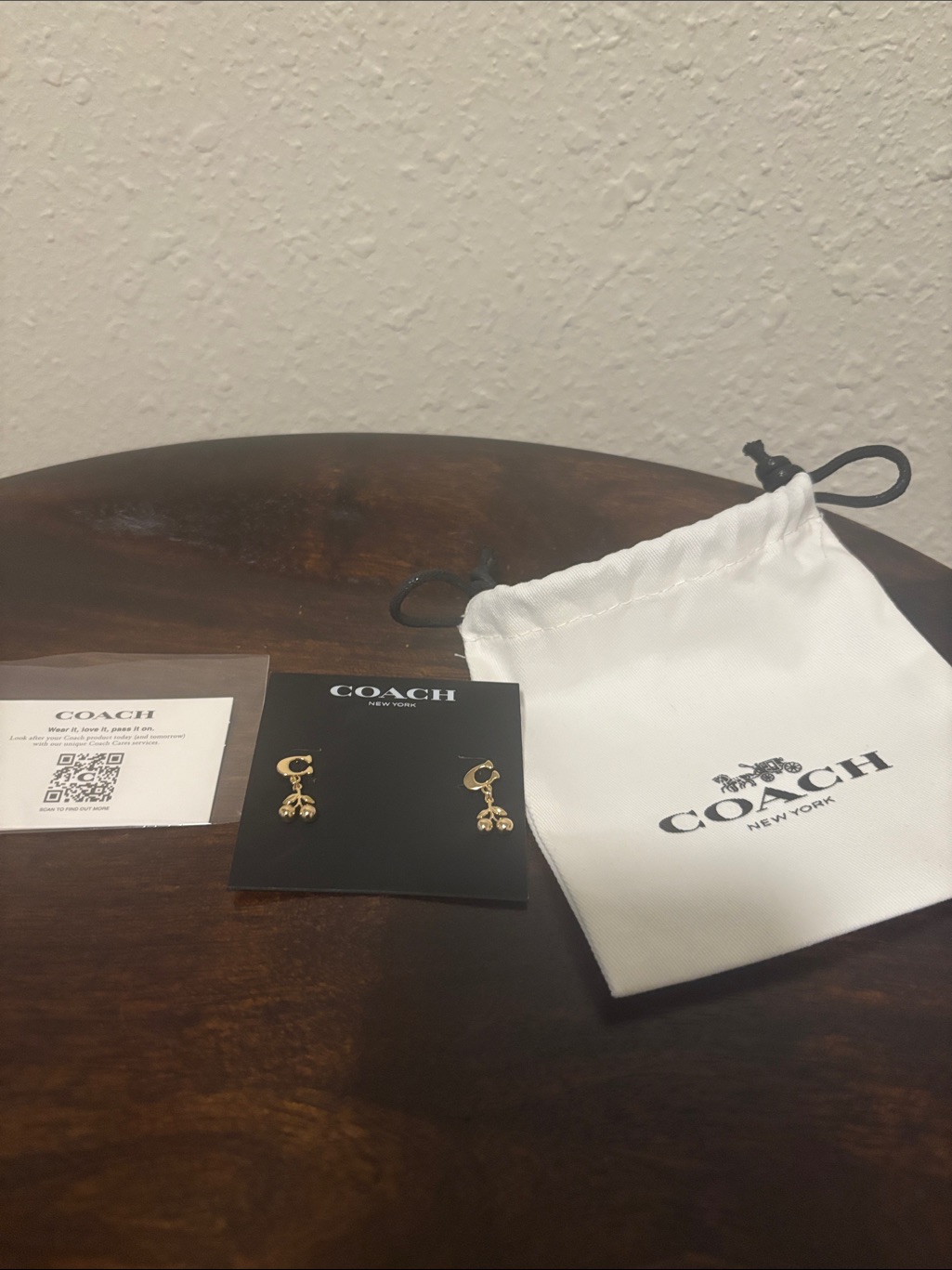 Coach Gold-Tone Charm Drop Earrings With White Logo Pouch